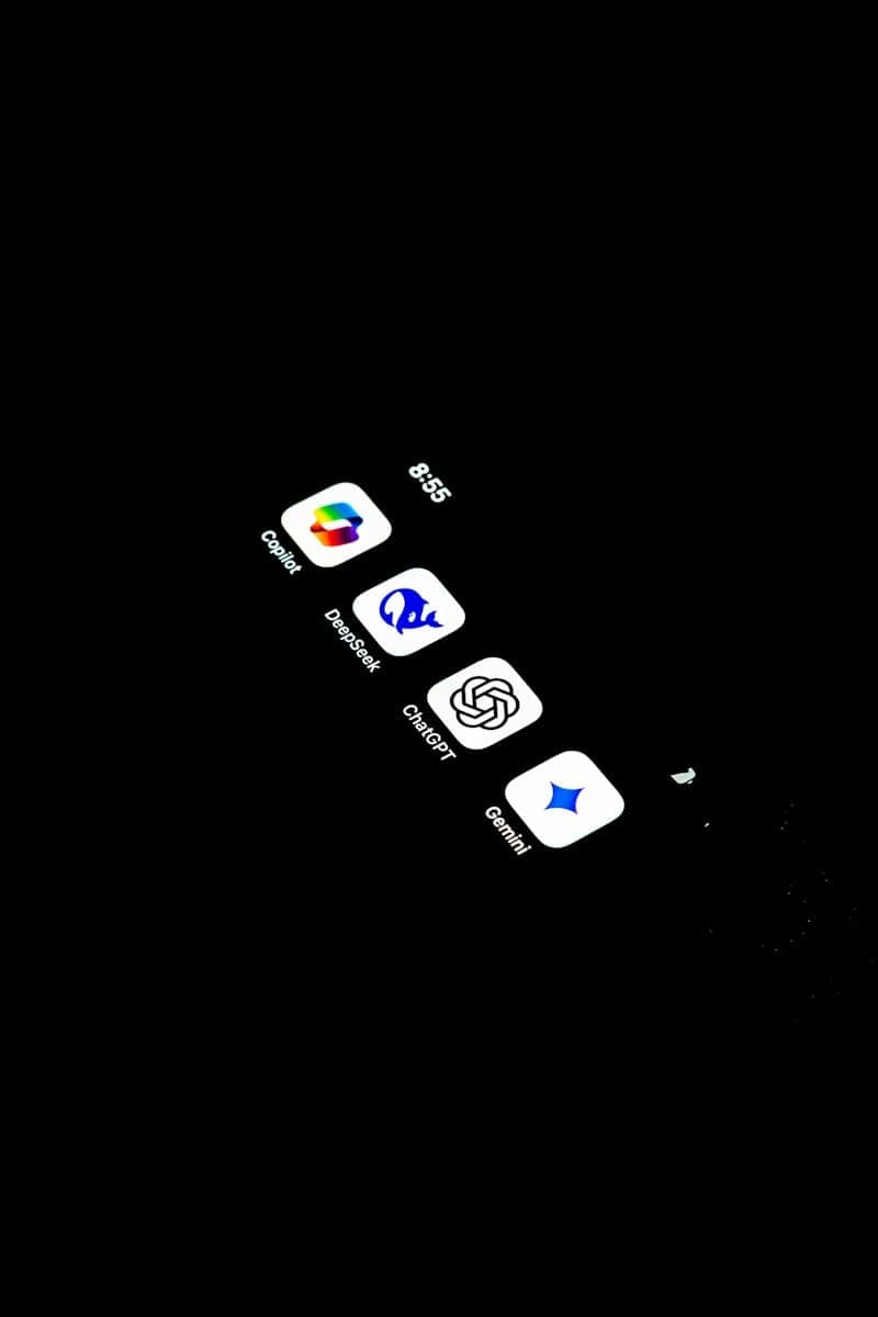 A cell phone with several AI tarot icons on the screen