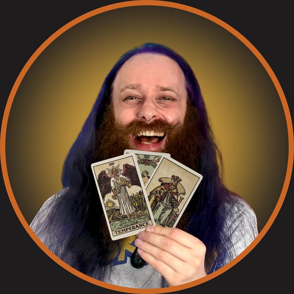 Gord holding some tarot cards with an orange circle around it
