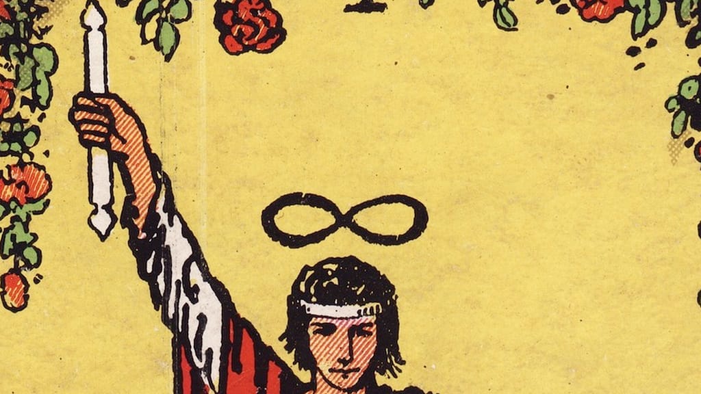 Close-up of the Magician in the Rider-Waite-Smith tarot, one hand raising a wand, with the infinity symbol over their head
