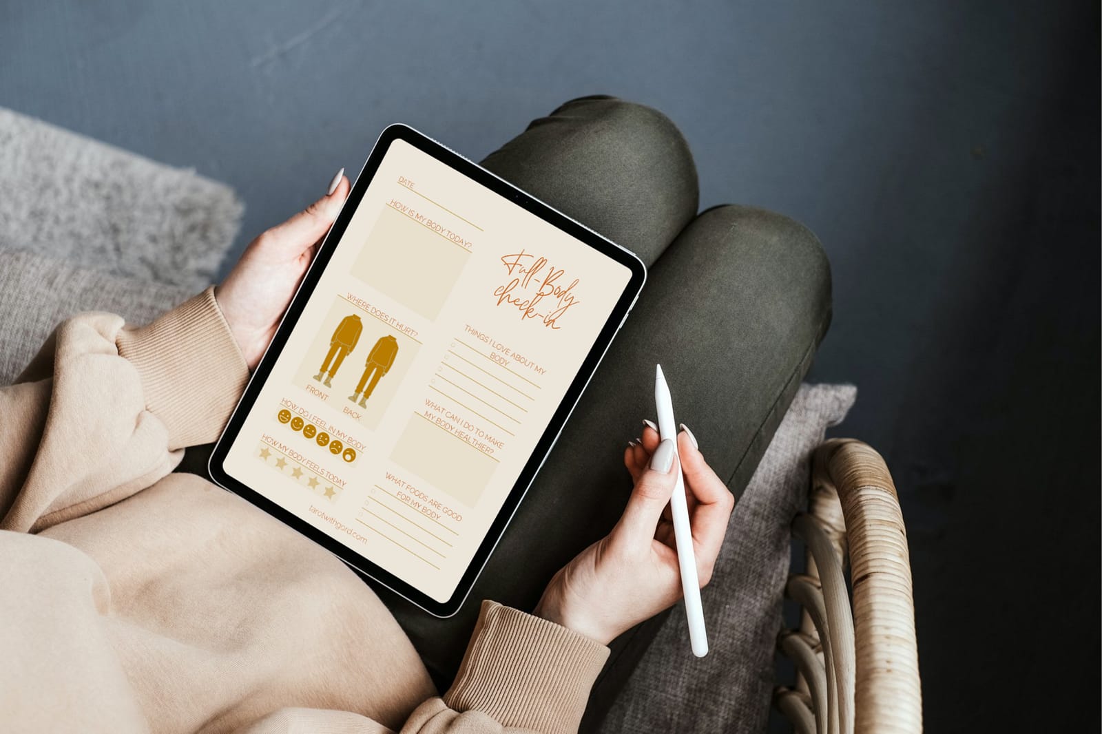 Somebody filling out the Full Body Check-In digital journal using an iPad with an Apple Pencil.