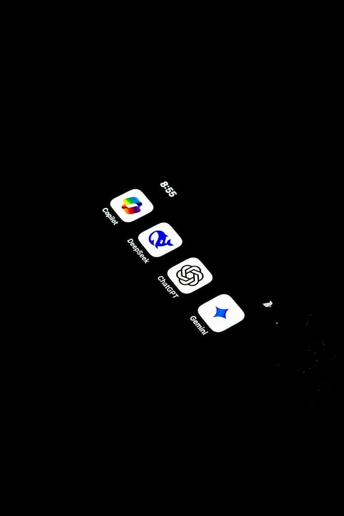 A cell phone with several AI tarot icons on the screen