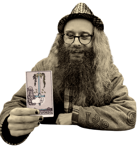Gord holding the Ace of Swords card
