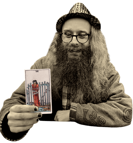 Gord holding the Eight of Swords card
