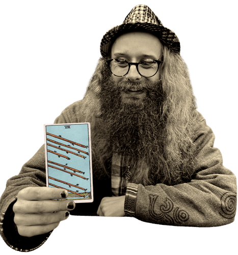 Gord holding the Eight of Wands card
