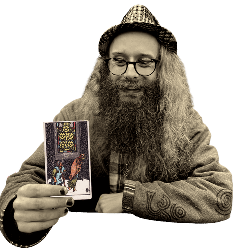 Gord holding the Five of Pentacles card
