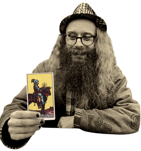 Gord holding the Knight of Pentacles card