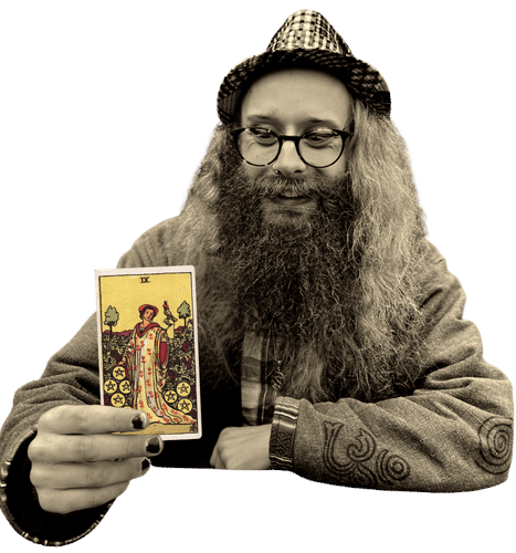 Gord holding the Nine of Pentacles card