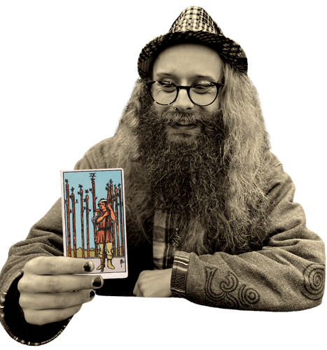 Gord holding the Nine of Wands card