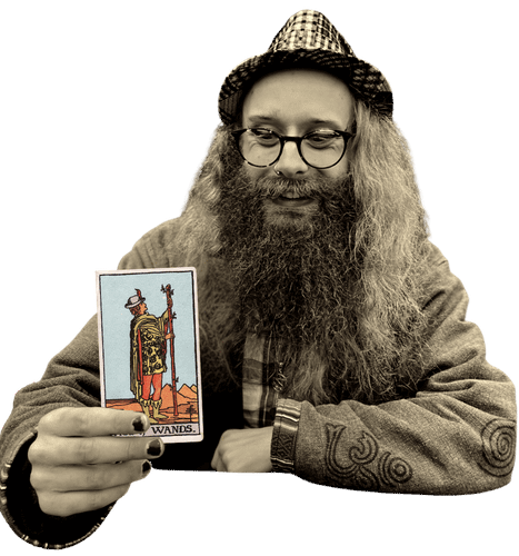 Gord holding the Page of Wands card