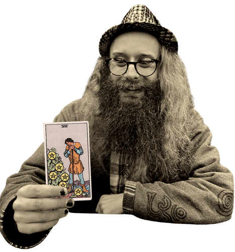Gord holding the Seven of Pentacles card