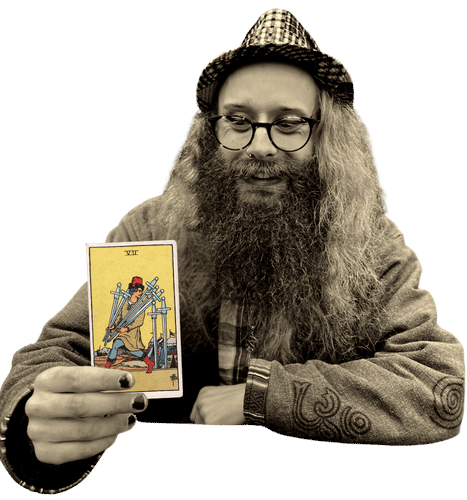 Gord holding the Seven of Swords card