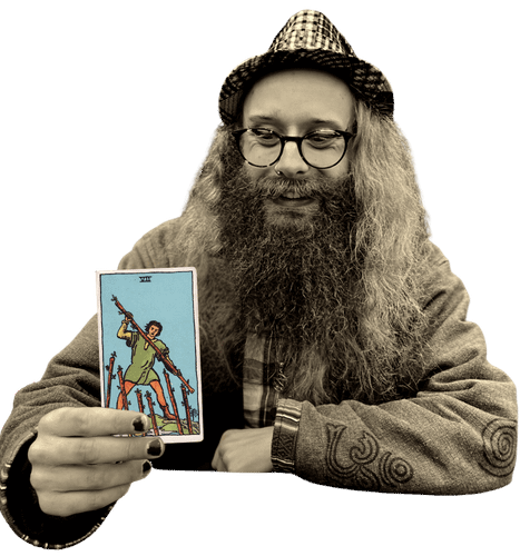 Gord holding the Seven of Wands card