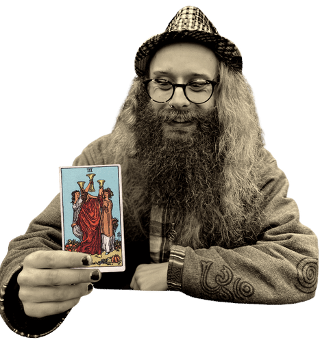 Gord holding the Three of Cups card