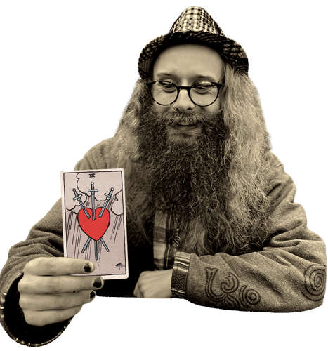 Gord holding the Three of Swords card