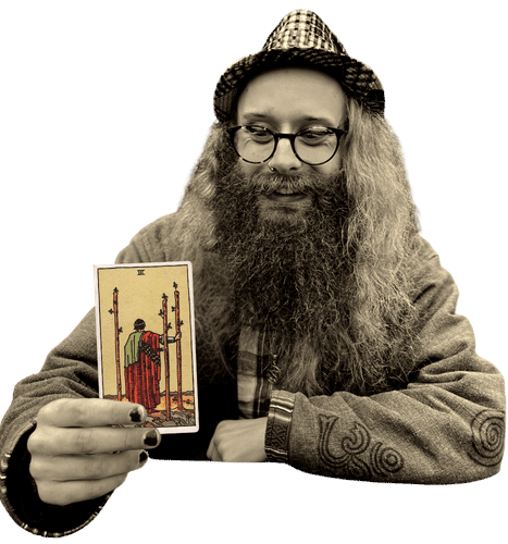 Gord holding the Three of Wands card