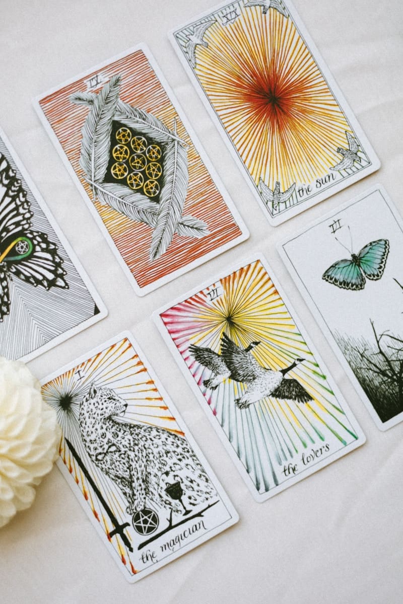 a bunch of tarot cards that are on a table
