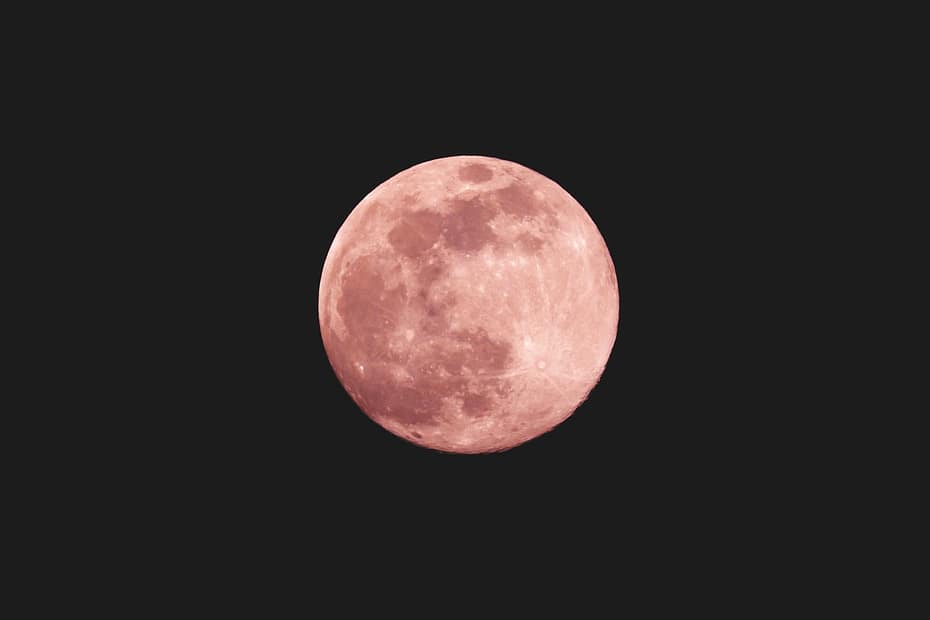 red moon on black background